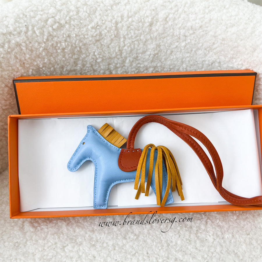 HERMES Rodeo PM Charm Bleu Celeste/ Natural Bouton d'Or/ Cornaline