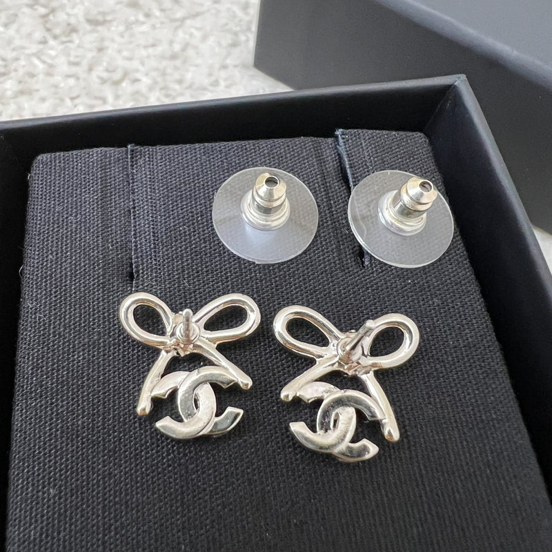 Chanel 25K Bow and Logo Earrings in SHW (Model: ABG601)