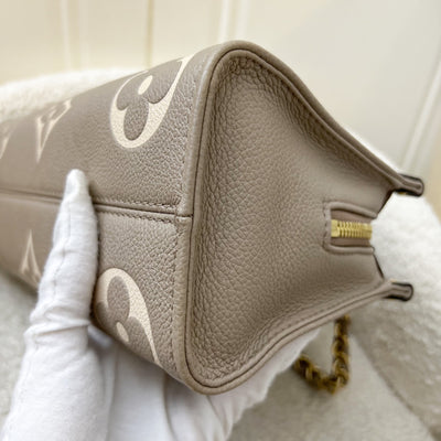 LV Onthego East West in Tourterelle (Grey) / Creme Giant Monogram Empreinte Leather and GHW (Model: M23641)