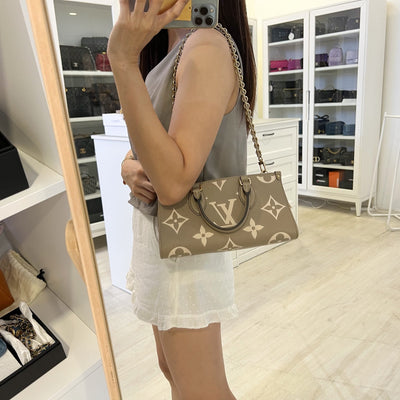 LV Onthego East West in Tourterelle (Grey) / Creme Giant Monogram Empreinte Leather and GHW (Model: M23641)