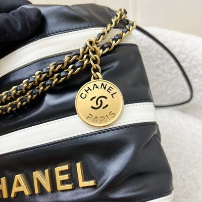 Chanel 22 Mini Hobo Handbag in 24S Striped Black and White Shiny Calfskin and AGHW (Detachable Strap)
