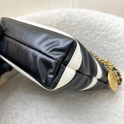 Chanel 22 Mini Hobo Handbag in 24S Striped Black and White Shiny Calfskin and AGHW (Detachable Strap)