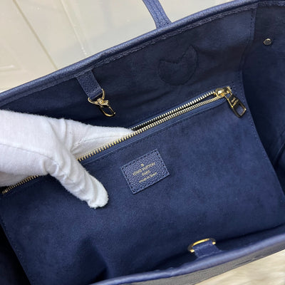LV Neverfull MM Tote in Navy Giant Monogram Empreinte Leather and GHW (With Attached Pouch)