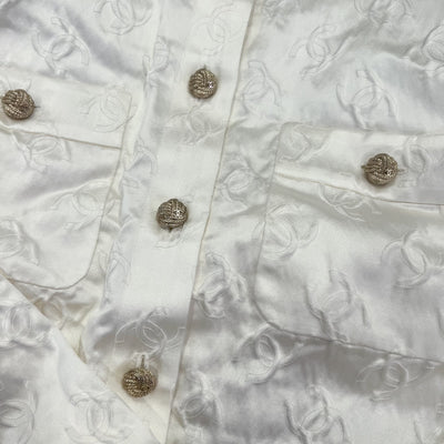 Chanel 25A Runway Embossed CC Logo Long Sleeved Blouse in Ecru Cotton and Silk (Model: P79802)