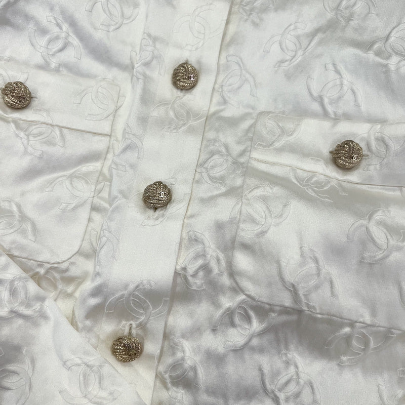 Chanel 25A Runway Embossed CC Logo Long Sleeved Blouse in Ecru Cotton and Silk (Model: P79802)