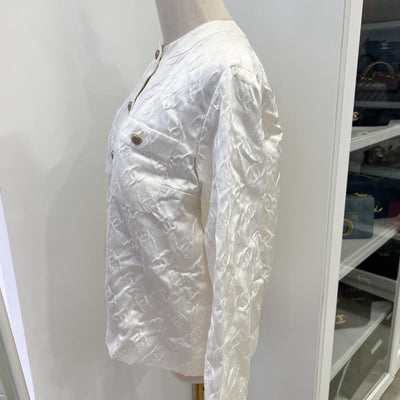 Chanel 25A Runway Embossed CC Logo Long Sleeved Blouse in Ecru Cotton and Silk (Model: P79802)