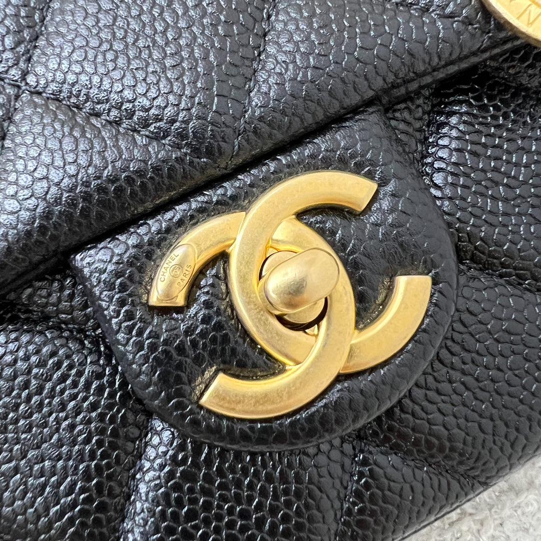 Chanel 21A Medallion Small Flap in Black Caviar and AGHW (Model