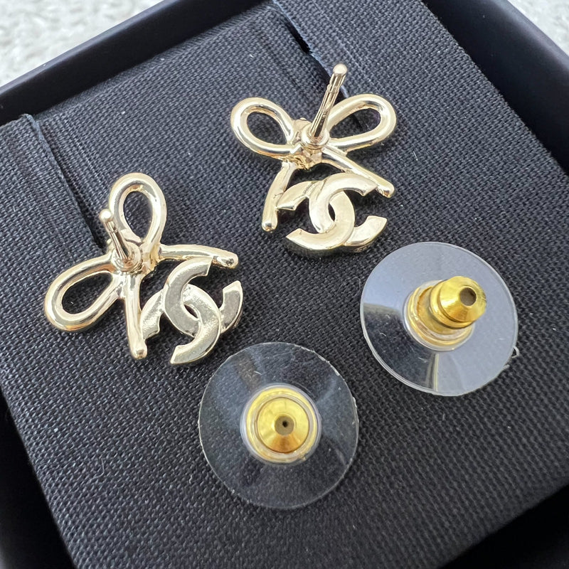 Chanel 25K Bow and Logo Earrings in LGHW (Model: ABG601)