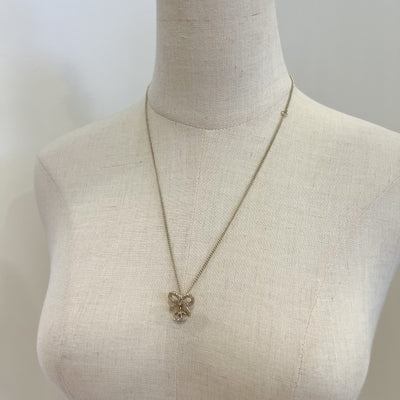 Chanel 25K Bow and Dangling Logo Necklace in SHW (Model: ABG556)