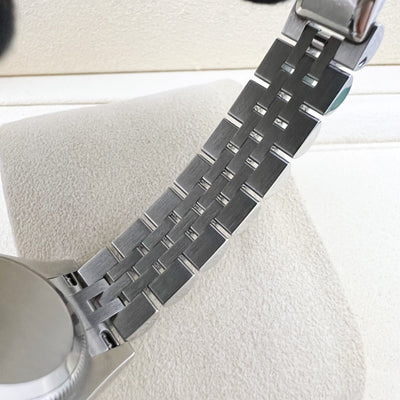 Rolex Lady's Datejust (26mm) with Silver Dial, 18K White Gold Fluted Bezel and Stainless Steel Jubilee Link Bracelet (179174)