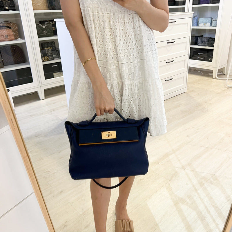 Hermes 24/24 29 Verso Bag in Bleu Saphir Maurice Leather, Navy and Sesame Swift Leather and GHW