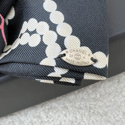 Chanel 23K Printed Pearl Motifs Bow Hair Clip in Black and Off White Fabric with Silver French Barrette