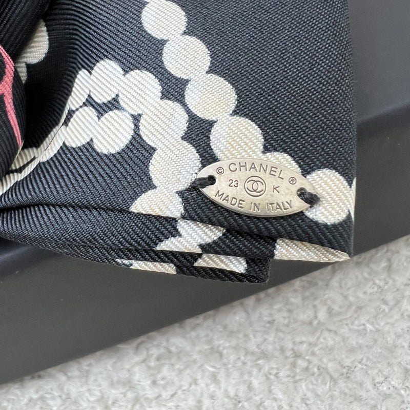 Chanel 23K Printed Pearl Motifs Bow Hair Clip in Black and Off White Fabric with Silver French Barrette