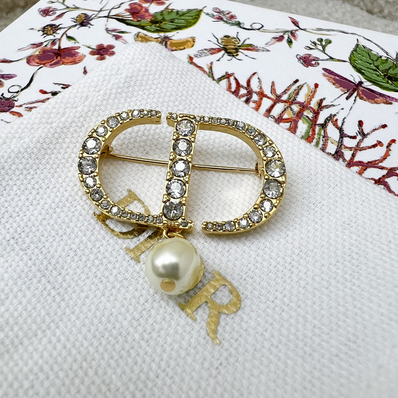 Dior Petit CD Brooch studded with Crystals and Dangling Pearl in Gold Tone HW