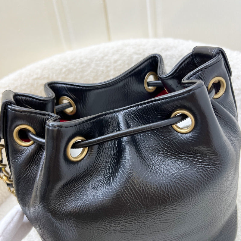 Chanel Mini Drawstring Bucket Bag in Glossy Distressed Black Calfskin and AGHW