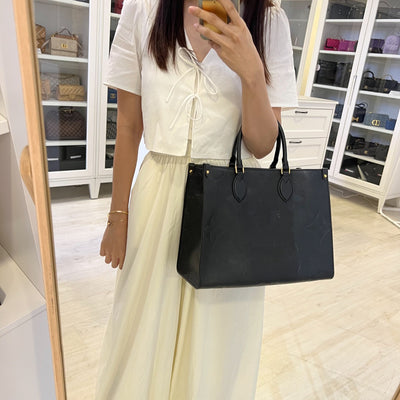 LV Onthego MM Tote in Black Giant Monogram Empreinte Leather and GHW