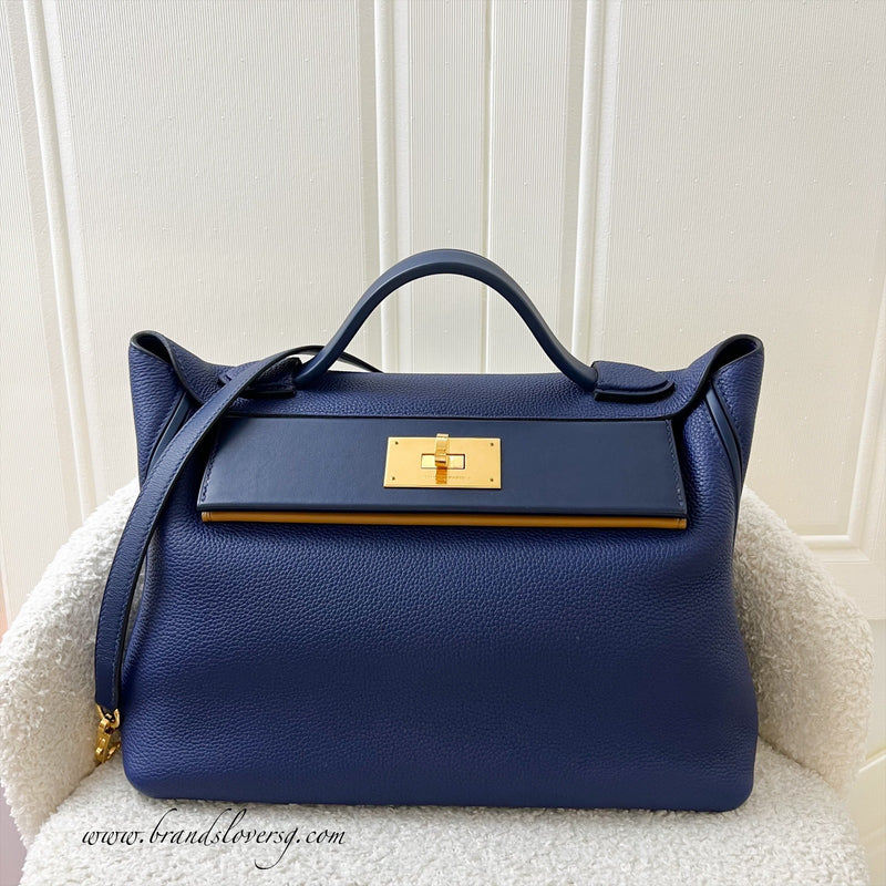 Hermes 24/24 29 Verso Bag in Bleu Saphir Maurice Leather, Navy and Sesame Swift Leather and GHW