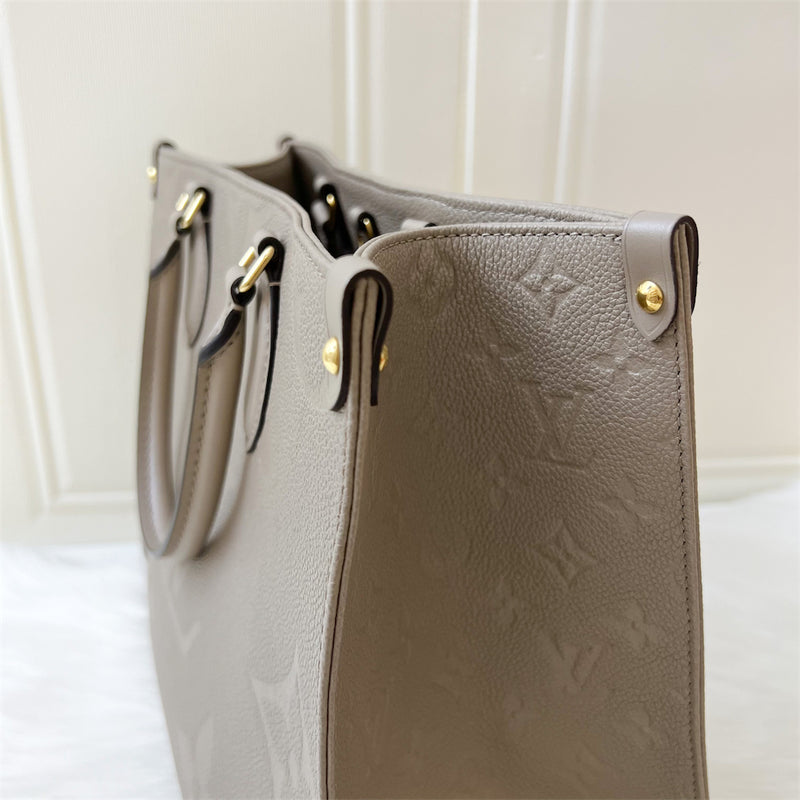 LV Onthego MM in Tourterelle Giant Monogram Empreinte Leather GHW